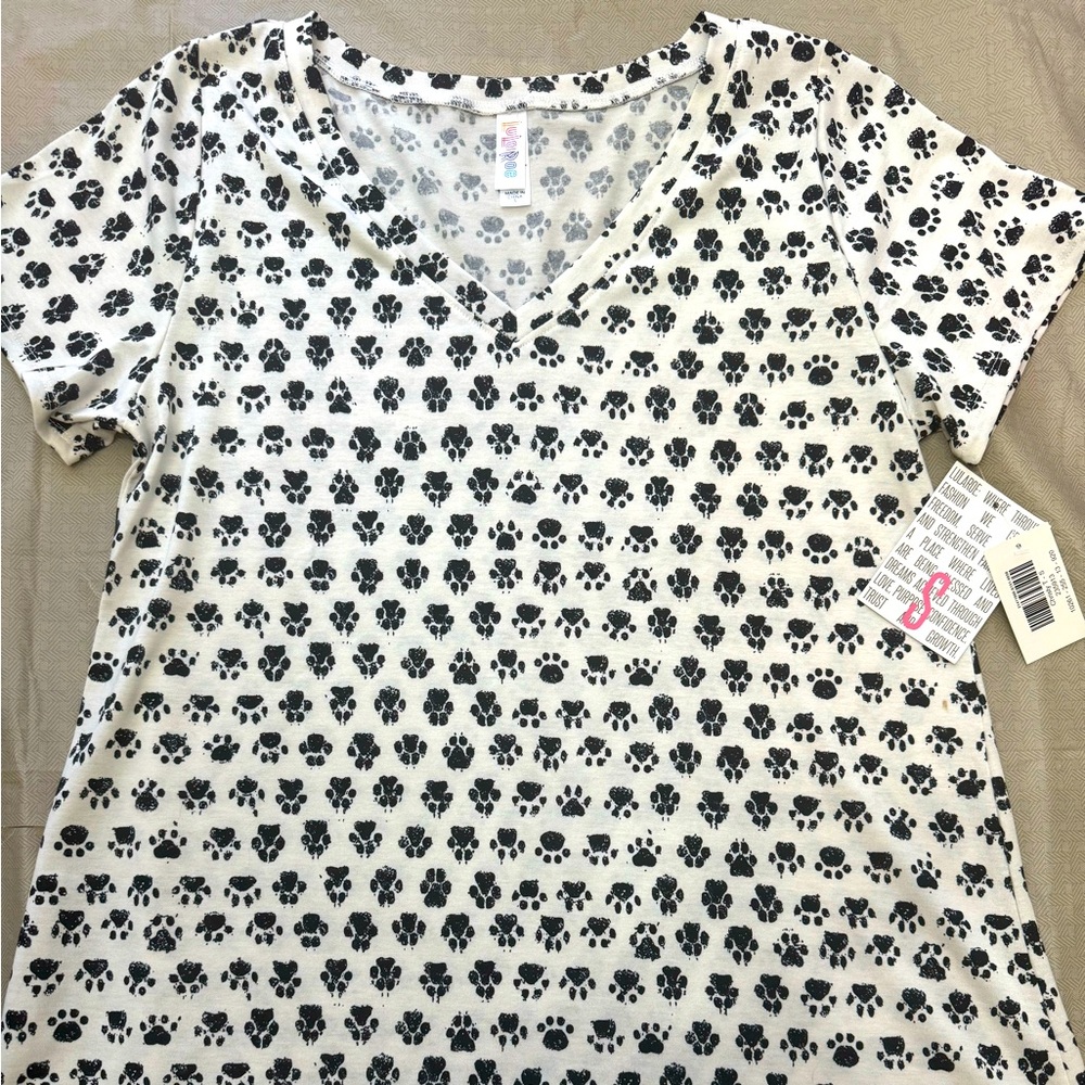 Brand new with tags never warn Lularoe V neck T white with black paw prints